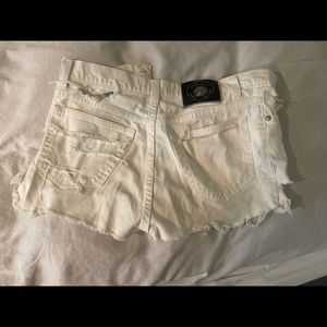 Distressed Versace white denim shorts